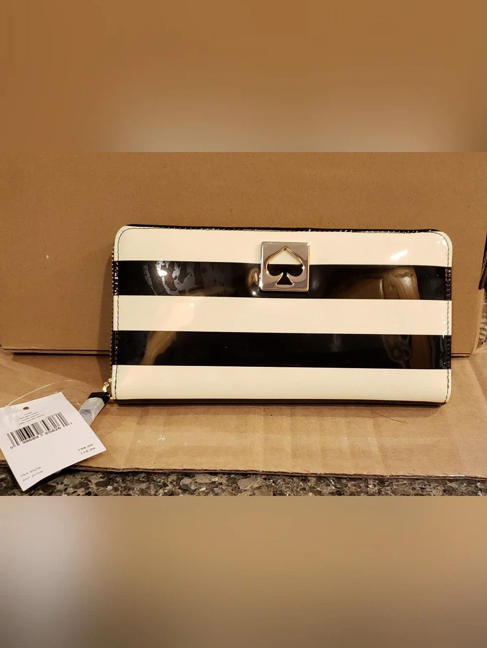 Kate spade Black and Cream Patent Stripe Zip Wallet.